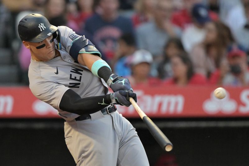 May 30, 2024; Anaheim, California, USA;  New York Yankees center fielder Aaron Judge (99) hits a two-run home run scoring right fielder Juan Soto (22) in the fourth inning against the Los Angeles Angels at Angel Stadium. Mandatory Credit: Jayne Kamin-Oncea-USA TODAY Sports