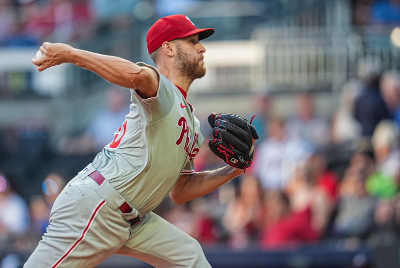 Aug 20, 2024; Cumberland, Georgia, USA; Philadelphia Phillies starting pitcher Zack Wheeler (45) pitches against the Atlanta Braves during the first inning at Truist Park. Mandatory Credit: Dale Zanine-USA TODAY Sports