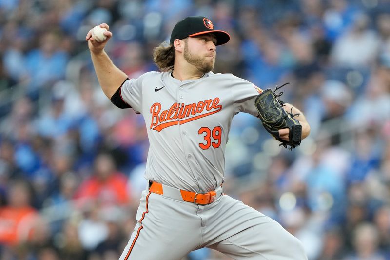 Jun 4, 2024; Toronto, Ontario, CAN; Baltimore Orioles starting pitcher Corbin Burnes (39) pitches to the Toronto Blue Jays during the second inning at Rogers Centre. Mandatory Credit: John E. Sokolowski-USA TODAY Sports