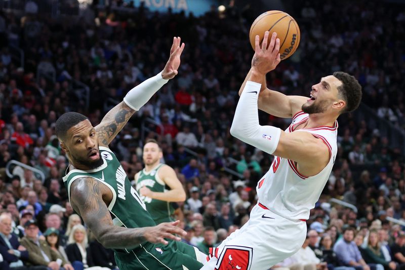 MILWAUKEE, WISCONSIN - OCTOBER 25: Zach LaVine #8 of the Chicago Bulls is fouled by Damian Lillard #0 of the Milwaukee Bucks during the first half of a game at Fiserv Forum on October 25, 2024 in Milwaukee, Wisconsin. NOTE TO USER: User expressly acknowledges and agrees that, by downloading and or using this photograph, User is consenting to the terms and conditions of the Getty Images License Agreement. (Photo by Stacy Revere/Getty Images)