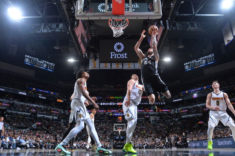 SAN ANTONIO, TX - APRIL 12:  Sandro Mamukelashvili #54 of the San Antonio Spurs  goes to the basket during the game on April 12, 2024 at the Frost Bank Center in San Antonio, Texas. NOTE TO USER: User expressly acknowledges and agrees that, by downloading and or using this photograph, user is consenting to the terms and conditions of the Getty Images License Agreement. Mandatory Copyright Notice: Copyright 2024 NBAE (Photos by Michael Gonzales/NBAE via Getty Images)