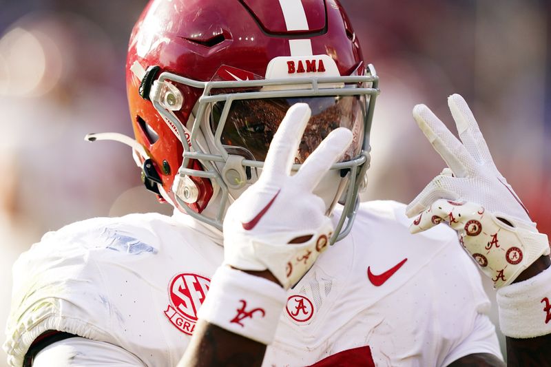 Nov 25, 2023; Auburn, Alabama, USA; Alabama Crimson Tide running back Roydell Williams (5) celebrates his touchdown against the Auburn Tigers during the first quarter at Jordan-Hare Stadium. Mandatory Credit: John David Mercer-USA TODAY Sports