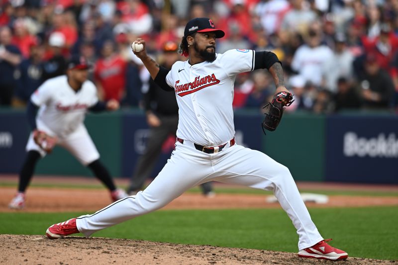 Oct 12, 2024; Cleveland, Ohio, USA; Cleveland Guardians pitcher Emmanuel Clase (48)  pitches in in the eighth inning against the Detroit Tigers  during game five of the ALDS for the 2024 MLB Playoffs at Progressive Field. Mandatory Credit: Ken Blaze-Imagn Images