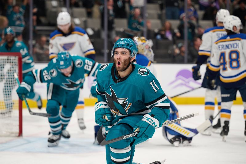 Nov 16, 2023; San Jose, California, USA; San Jose Sharks center Luke Kunin (11) reacts after scoring a goal against St. Louis Blues goaltender Joel Hofer (30) during the second period at SAP Center at San Jose. Mandatory Credit: Robert Edwards-USA TODAY Sports