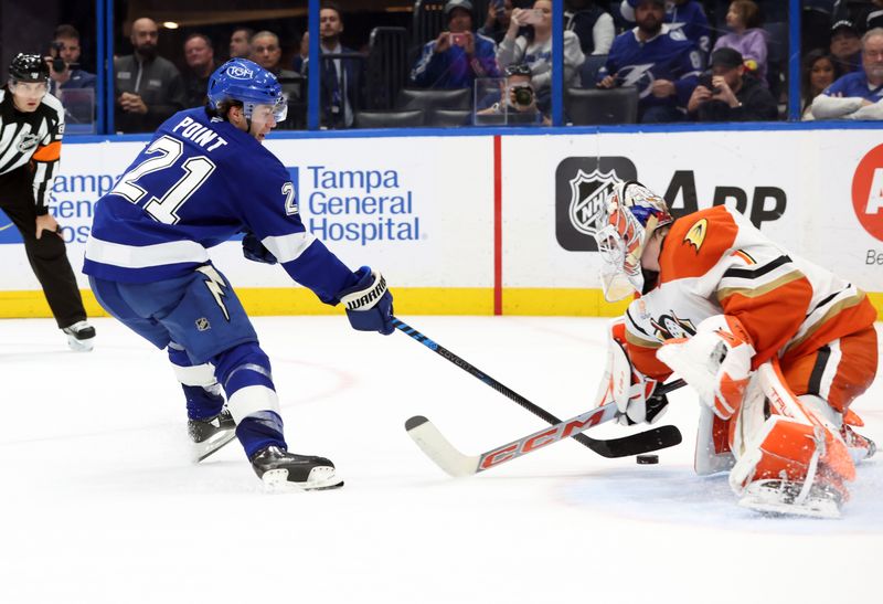 Jan 16, 2025; Tampa, Florida, USA; Anaheim Ducks goaltender Lukas Dostal (1) makes save on Tampa Bay Lightning center Brayden Point (21) during overtime shootout at Amalie Arena. Mandatory Credit: Kim Klement Neitzel-Imagn Images