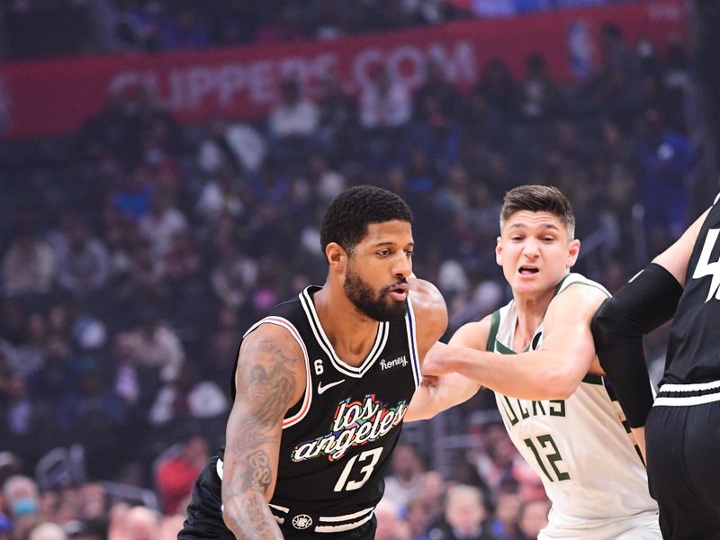 LOS ANGELES, CA - FEBRUARY 10: Paul George #13 of the LA Clippers drives to the basket during the game against the Milwaukee Bucks on February 10, 2023 at Crypto.Com Arena in Los Angeles, California. NOTE TO USER: User expressly acknowledges and agrees that, by downloading and/or using this Photograph, user is consenting to the terms and conditions of the Getty Images License Agreement. Mandatory Copyright Notice: Copyright 2023 NBAE (Photo by Adam Pantozzi/NBAE via Getty Images)