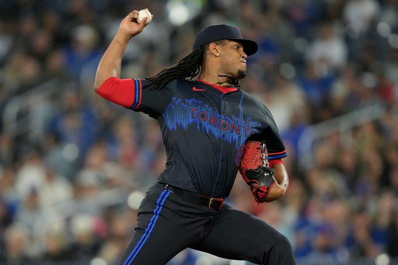 Sep 9, 2024; Toronto, Ontario, CAN; Toronto Blue Jays pitcher Luis Fria (63) pitches to the New York Mets during the third inning at Rogers Centre. Mandatory Credit: John E. Sokolowski-Imagn Images