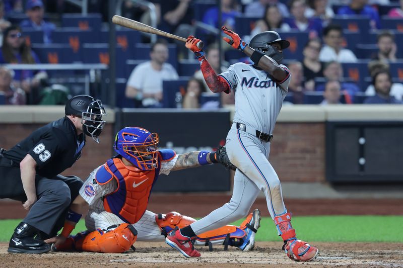 Jun 12, 2024; New York City, New York, USA; Miami Marlins center fielder Jazz Chisolm Jr. (2) follows through on an RBI single against the New York Mets during the fifth inning at Citi Field. Mandatory Credit: Brad Penner-USA TODAY Sports