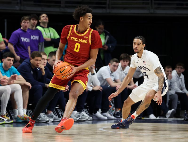 Feb 8, 2026; University Park, Pennsylvania, USA; Southern California Trojans guard Alijah Arenas (0) moves with the ball as Penn State Nittany Lions guard Freddie Dilione V (5) defends during the first half at Bryce Jordan Center. Mandatory Credit: Matthew O'Haren-Imagn Images