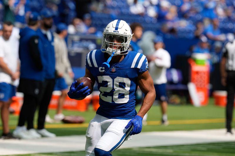 Indianapolis Colts running back Jonathan Taylor (28) warms up an NFL football game against the Houston Texans, Sunday, Sept. 8, 2024, in Indianapolis. (AP Photo/Darron Cummings)