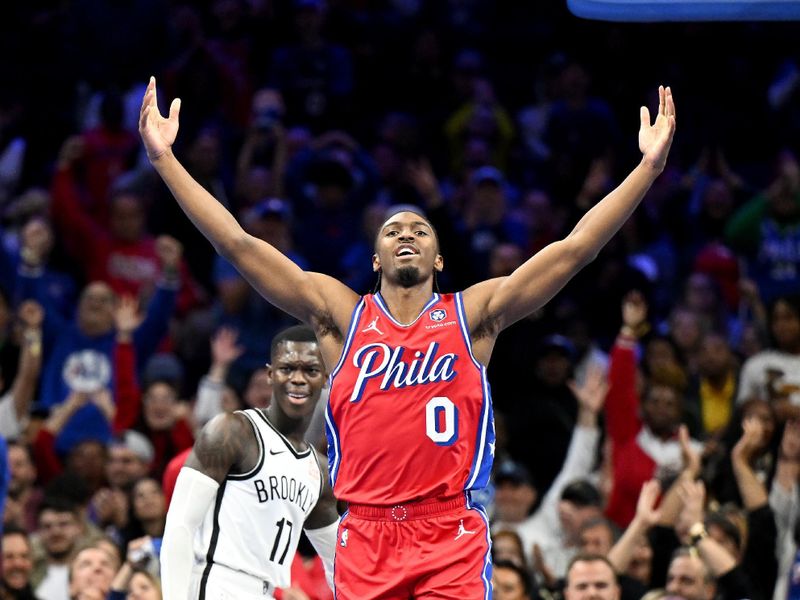 PHILADELPHIA, PENNSYLVANIA - NOVEMBER 22: Tyrese Maxey #0 of the Philadelphia 76ers celebrates after dunking the ball in the fourth quarter against the Brooklyn Nets in the NBA Emirates Cup at the Wells Fargo Center on November 22, 2024 in Philadelphia, Pennsylvania. NOTE TO USER: User expressly acknowledges and agrees that, by downloading and or using this photograph, User is consenting to the terms and conditions of the Getty Images License Agreement. (Photo by G Fiume/Getty Images)