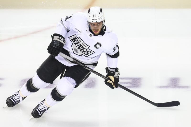 Nov 11, 2024; Calgary, Alberta, CAN; Los Angeles Kings center Anze Kopitar (11) skates during the warmup period against the Calgary Flames at Scotiabank Saddledome. Mandatory Credit: Sergei Belski-Imagn Images