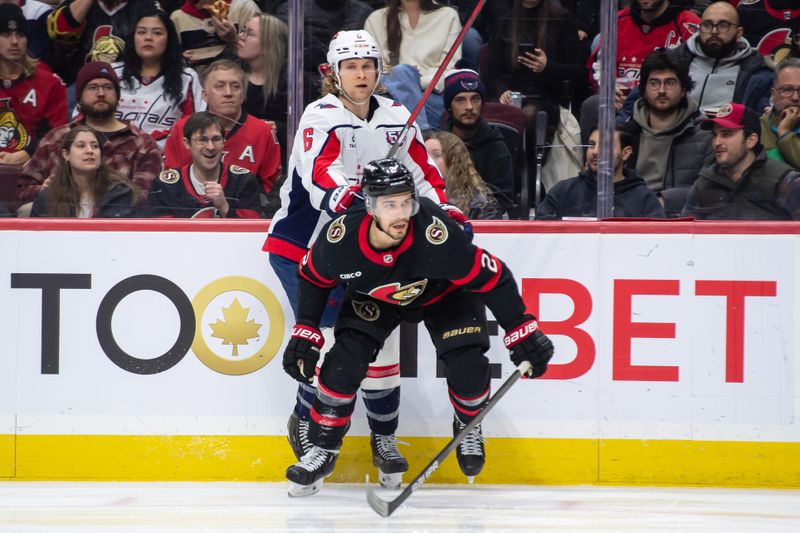 Jan 16, 2025; Ottawa, Ontario, CAN; Washington Capitals defenseman Jakob Chychrun (6) is held up by Ottawa Senators defenseman Artem Zub (2) in the second period at the Canadian Tire Centre. Mandatory Credit: Marc DesRosiers-Imagn Images