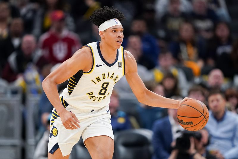 INDIANAPOLIS, INDIANA - OCTOBER 14: Enrique Freeman #8 of the Indiana Pacers dribbles the ball in the second quarter against the Memphis Grizzlies during a preseason game at Gainbridge Fieldhouse on October 14, 2024 in Indianapolis, Indiana. NOTE TO USER: User expressly acknowledges and agrees that, by downloading and or using this photograph, User is consenting to the terms and conditions of the Getty Images License Agreement. (Photo by Dylan Buell/Getty Images)