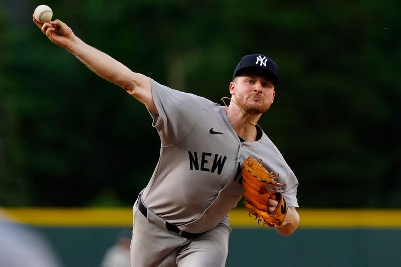 May 23, 2025; Denver, Colorado, USA; New York Yankees starting pitcher Clarke Schmidt (36) delivers a pitch in the first inning against the Colorado Rockies at Coors Field. Mandatory Credit: Ron Chenoy-Imagn Images