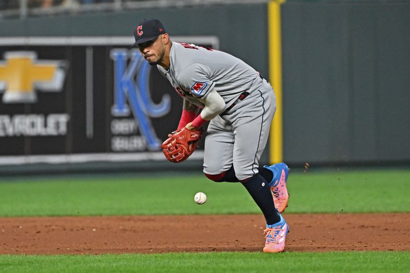 Sep 19, 2023; Kansas City, Missouri, USA; Cleveland Guardians shortstop Gabriel Arias (13) bobbles the ball allowing a run to score in the third inning against the Kansas City Royals at Kauffman Stadium. Mandatory Credit: Peter Aiken-USA TODAY Sports