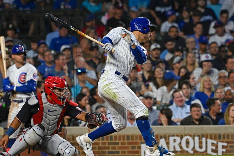 Jul 19, 2023; Chicago, Illinois, USA;  Chicago Cubs center fielder Mike Tauchman (40) hits an RBI double against the Washington Nationals during the fourth inning at Wrigley Field. Mandatory Credit: Matt Marton-USA TODAY Sports