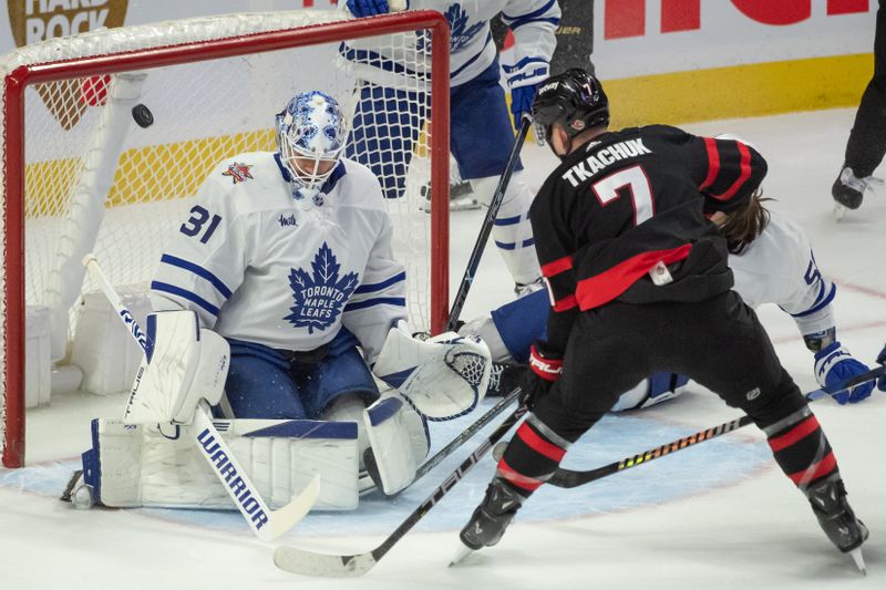 Dec 7, 2023; Ottawa, Ontario, CAN; Toronto Maple Leafs goalie Martin Jones (31) makes a save on a shot from  Ottawa Senators left wing Brady Tkachuk (7) in the third period at the Canadian Tire Centre. Mandatory Credit: Marc DesRosiers-USA TODAY Sports