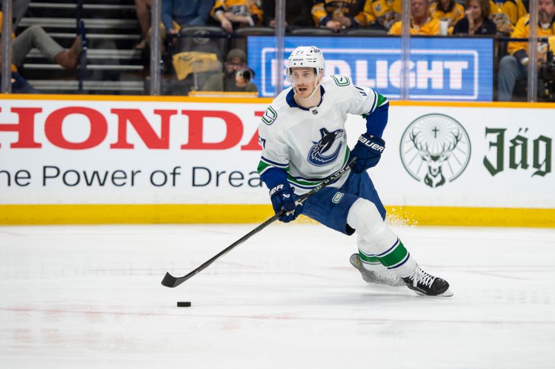 May 3, 2024; Nashville, Tennessee, USA; Vancouver Canucks defenseman Tyler Myers (57) skates with the puck against the Nashville Predators during the first period in game six of the first round of the 2024 Stanley Cup Playoffs at Bridgestone Arena. Mandatory Credit: Steve Roberts-USA TODAY Sports