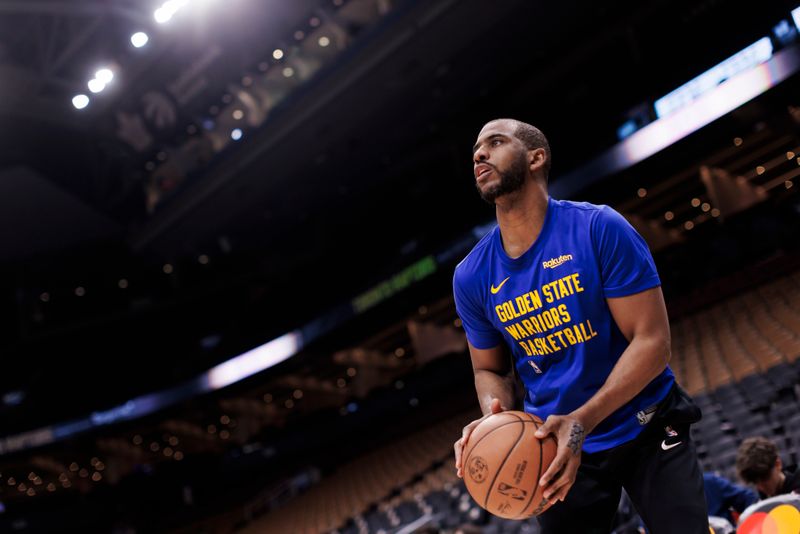 TORONTO, CANADA - MARCH 1: Chris Paul #3 of the Golden State Warriors warms up ahead of their NBA game against the Toronto Raptors at Scotiabank Arena on March 1, 2024 in Toronto, Canada.  NOTE TO USER: User expressly acknowledges and agrees that, by downloading and or using this photograph, User is consenting to the terms and conditions of the Getty Images License Agreement. (Photo by Cole Burston/Getty Images)