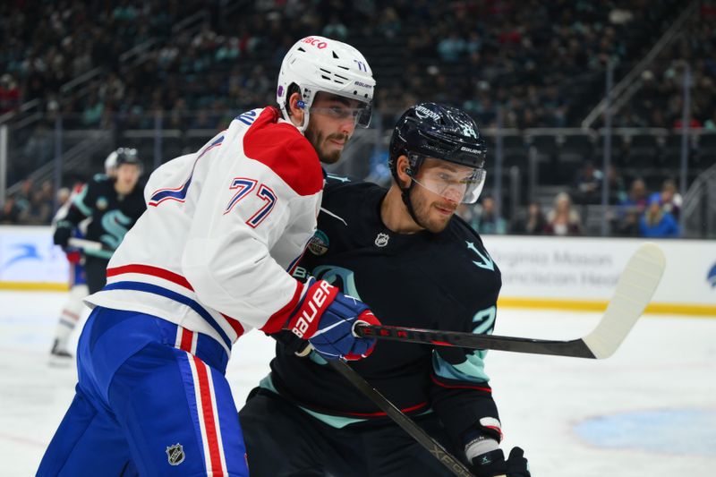 Oct 28, 2025; Seattle, Washington, USA; Montreal Canadiens center Kirby Dach (77) and Seattle Kraken defenseman Jamie Oleksiak (24) during the second period at Climate Pledge Arena. Mandatory Credit: Steven Bisig-Imagn Images