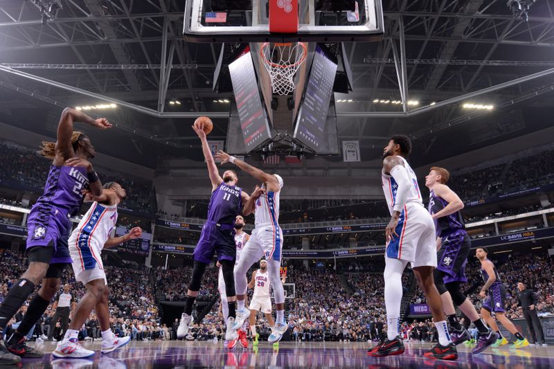 SACRAMENTO, CA - JANUARY 1:  Domantas Sabonis #11 of the Sacramento Kings drives to the basket during the game against the Philadelphia 76ers on January 1, 2025 at Golden 1 Center in Sacramento, California. NOTE TO USER: User expressly acknowledges and agrees that, by downloading and or using this Photograph, user is consenting to the terms and conditions of the Getty Images License Agreement. Mandatory Copyright Notice: Copyright 2025 NBAE (Photo by Rocky Widner/NBAE via Getty Images)