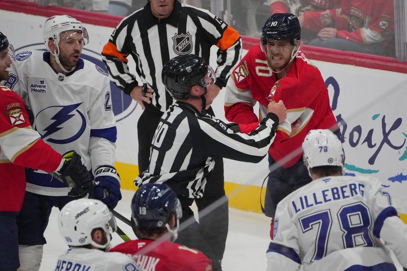 Sep 30, 2024; Sunrise, Florida, USA; Florida Panthers left wing A.J. Greer (10) gets in a scuffle with Tampa Bay Lightning defenseman Emil Lilleberg (78) during the second period at Amerant Bank Arena. Mandatory Credit: Jim Rassol-Imagn Images