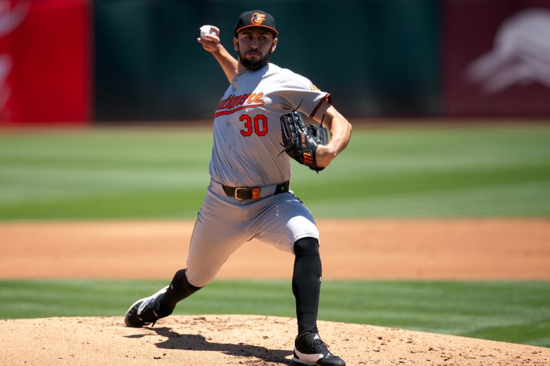 Jul 7, 2024; Oakland, California, USA; Baltimore Orioles starting pitcher Grayson Rodriguez (30) delivers a pitch against the Oakland Athletics during the first inning at Oakland-Alameda County Coliseum. Mandatory Credit: D. Ross Cameron-USA TODAY Sports