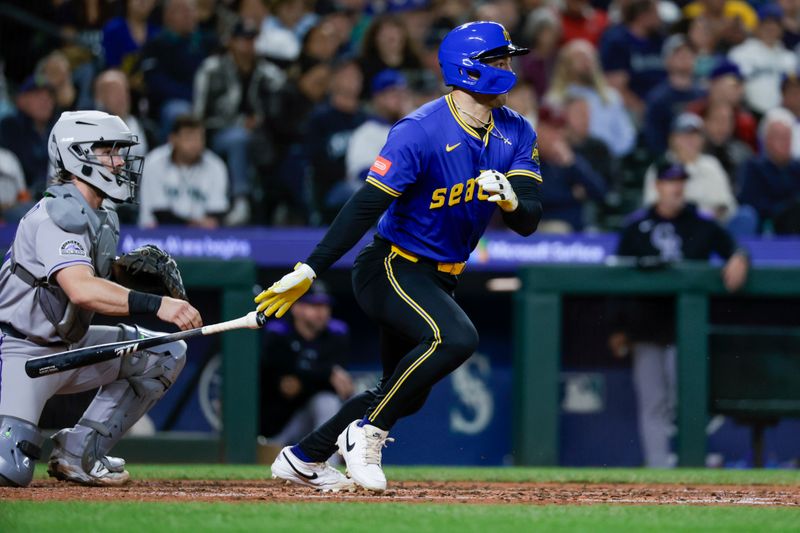 Sep 25, 2025; Seattle, Washington, USA; Seattle Mariners right fielder Dominic Canzone (8) hits an RBI-fielders choice against the Colorado Rockies during the fourth inning at T-Mobile Park. Mandatory Credit: Joe Nicholson-Imagn Images