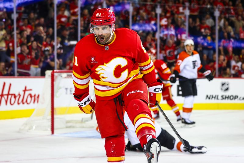 Oct 12, 2024; Calgary, Alberta, CAN; Calgary Flames center Nazem Kadri (91) celebrates his goal against the Philadelphia Flyers during the second period at Scotiabank Saddledome. Mandatory Credit: Sergei Belski-Imagn Images