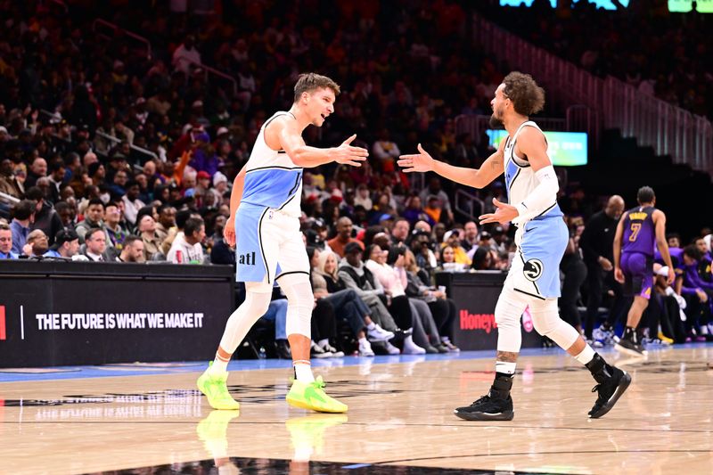 ATLANTA, GA - DECEMBER 6: Bogdan Bogdanovic #13 and Trae Young #11 of the Atlanta Hawks high five during the game against the Los Angeles Lakers on December 6, 2024 at State Farm Arena in Atlanta, Georgia.  NOTE TO USER: User expressly acknowledges and agrees that, by downloading and/or using this Photograph, user is consenting to the terms and conditions of the Getty Images License Agreement. Mandatory Copyright Notice: Copyright 2024 NBAE (Photo by Adam Hagy/NBAE via Getty Images)