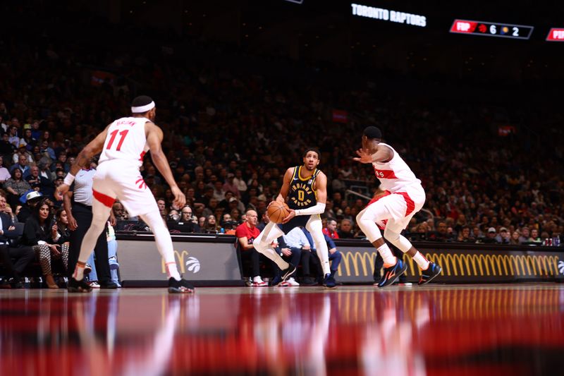TORONTO, CANADA - APRIL 9:  Tyrese Haliburton #0 of the Indiana Pacers handles the ball during the game  on April 9, 2024 at the Scotiabank Arena in Toronto, Ontario, Canada.  NOTE TO USER: User expressly acknowledges and agrees that, by downloading and or using this Photograph, user is consenting to the terms and conditions of the Getty Images License Agreement.  Mandatory Copyright Notice: Copyright 2024 NBAE (Photo by Vaughn Ridley/NBAE via Getty Images)