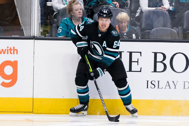 Mar 5, 2024; San Jose, California, USA; San Jose Sharks center Mikael Granlund (64) looks to pass against the Dallas Stars during the second period at SAP Center at San Jose. Mandatory Credit: John Hefti-USA TODAY Sports