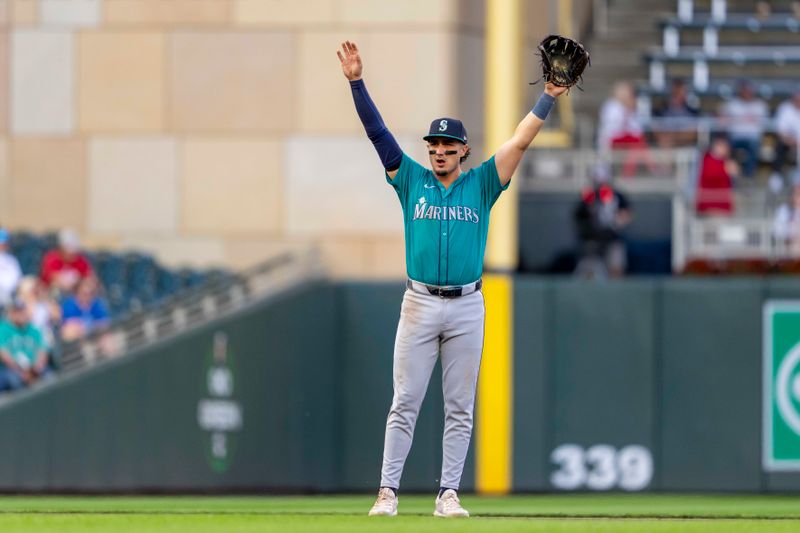 May 8, 2024; Minneapolis, Minnesota, USA; Seattle Mariners third baseman Josh Rojas (4) reacts against the Minnesota Twins in the fourth inning at Target Field. Mandatory Credit: Jesse Johnson-USA TODAY Sports