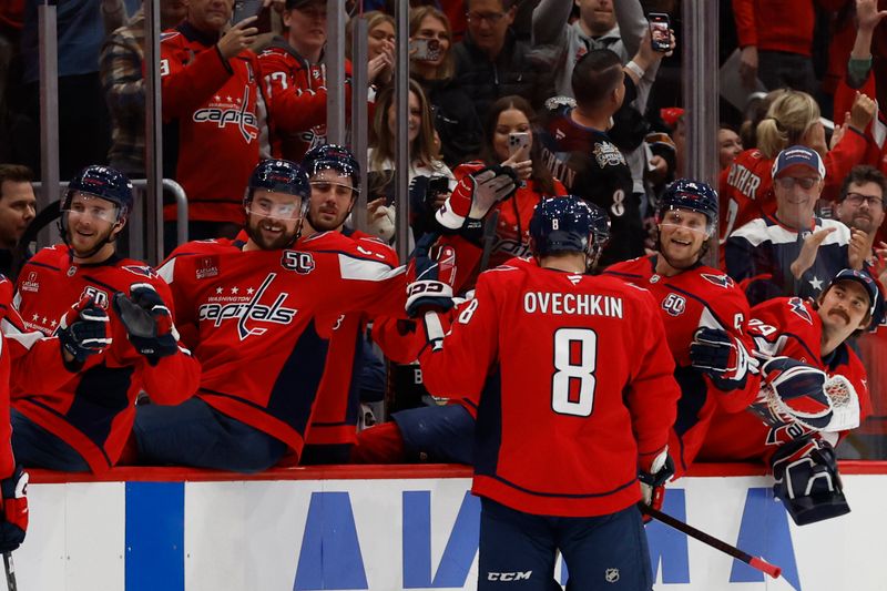 Oct 23, 2024; Washington, District of Columbia, USA; Washington Capitals left wing Alex Ovechkin (8) celebrates with teammates after scoring an empty net goal against the Philadelphia Flyers in the third period goal at Capital One Arena. Mandatory Credit: Geoff Burke-Imagn Images