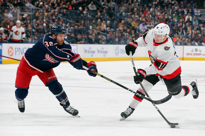 Dec 1, 2023; Columbus, Ohio, USA; Ottawa Senators left wing Tim Stutzle (18) wrists a shot on goal as Columbus Blue Jackets center Boone Jenner (38) defends during the first period at Nationwide Arena. Mandatory Credit: Russell LaBounty-USA TODAY Sports