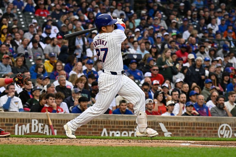 Sep 28, 2024; Chicago, Illinois, USA;  Chicago Cubs outfielder Seiya Suzuki (27) hits a single against the Cincinnati Reds during the first inning at Wrigley Field. Mandatory Credit: Matt Marton-Imagn Images