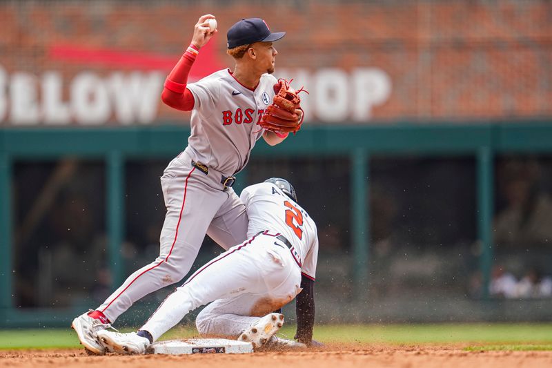 Jun 1, 2025; Cumberland, Georgia, USA; Boston Red Sox second baseman Kristian Campbell (28) is hit by Atlanta Braves shortstop Nick Allen (2) while trying to throw during the fifth inning at Truist Park. Mandatory Credit: Dale Zanine-Imagn Images