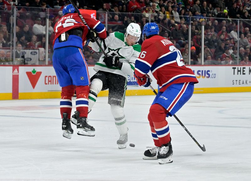 Feb 10, 2024; Montreal, Quebec, CAN; Montreal Canadiens defenseman Arber Xhekaj (72) collides with Dallas Stars forward Ty Dellandrea (10) during the third period at the Bell Centre. Mandatory Credit: Eric Bolte-USA TODAY Sports