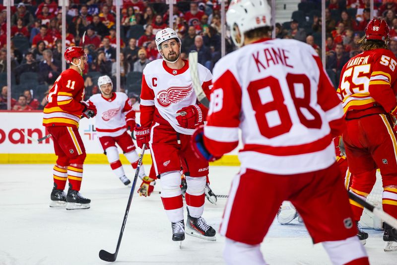 Feb 17, 2024; Calgary, Alberta, CAN; Detroit Red Wings center Dylan Larkin (71) celebrates his goal with Detroit Red Wings right wing Patrick Kane (88) during the second period against the Calgary Flames at Scotiabank Saddledome. Mandatory Credit: Sergei Belski-USA TODAY Sports