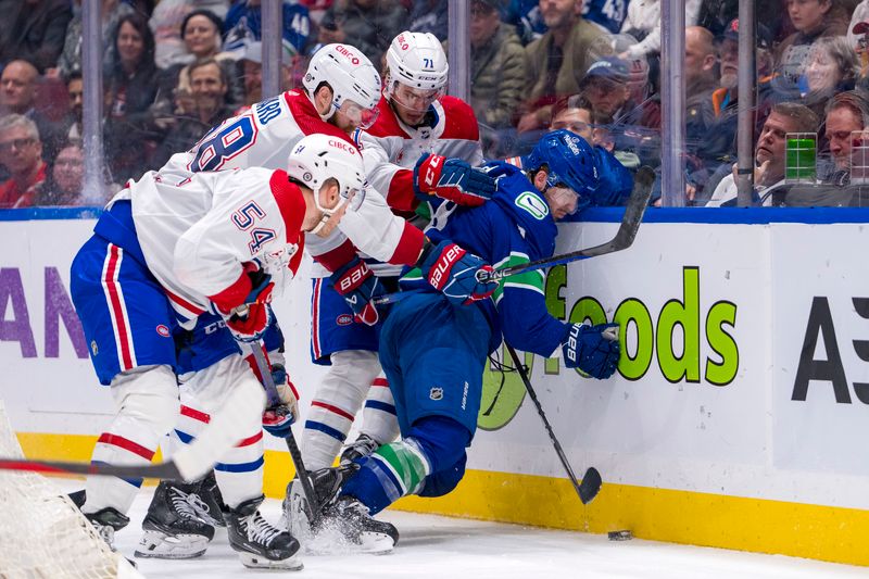 Mar 21, 2024; Vancouver, British Columbia, CAN; Montreal Canadiens defenseman Jordan Harris (54) and defenseman David Savard (58) and forward Jake Evans (71) battle with Vancouver Canucks forward Conor Garland (8) in the third period at Rogers Arena. Vancouver won 4 -1. Mandatory Credit: Bob Frid-USA TODAY Sports