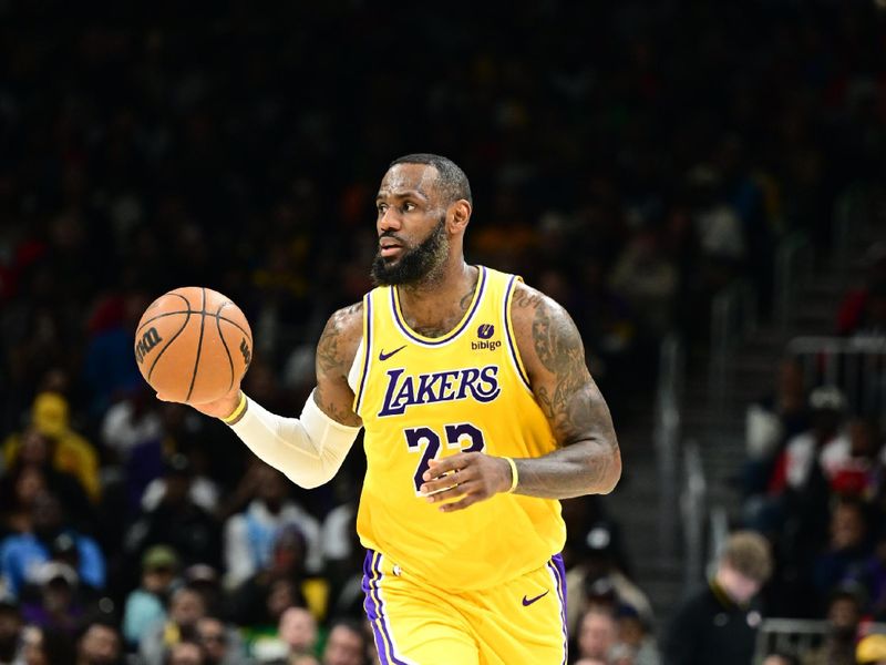 ATLANTA, GA - JANUARY 30: LeBron James #23 of the Los Angeles Lakers handles the ball during the game  against the Atlanta Hawks on January 30, 2024 at State Farm Arena in Atlanta, Georgia.  NOTE TO USER: User expressly acknowledges and agrees that, by downloading and/or using this Photograph, user is consenting to the terms and conditions of the Getty Images License Agreement. Mandatory Copyright Notice: Copyright 2024 NBAE (Photo by Adam Hagy/NBAE via Getty Images)