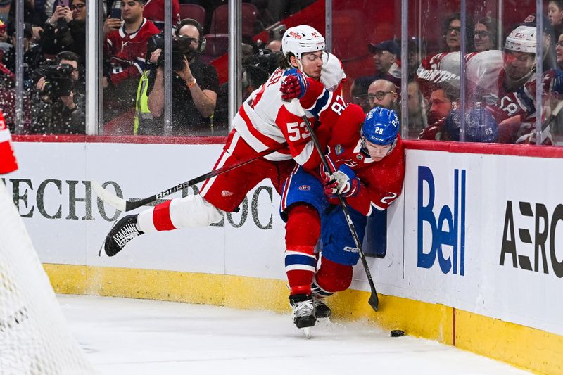 Dec 2, 2023; Montreal, Quebec, CAN; Detroit Red Wings defenseman Moritz Seider (53) checks Montreal Canadiens center Christian Dvorak (28) into the boards during the third period at Bell Centre. Mandatory Credit: David Kirouac-USA TODAY Sports