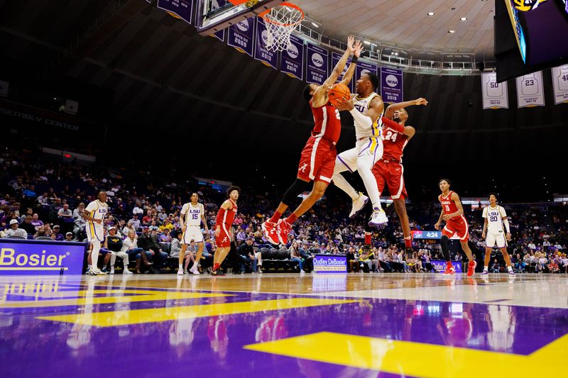 Feb 4, 2023; Baton Rouge, Louisiana, USA; LSU Tigers forward KJ Williams (12) shoots the ball against Alabama Crimson Tide forward Brandon Miller (24) during the first half at Pete Maravich Assembly Center. Mandatory Credit: Andrew Wevers-USA TODAY Sports