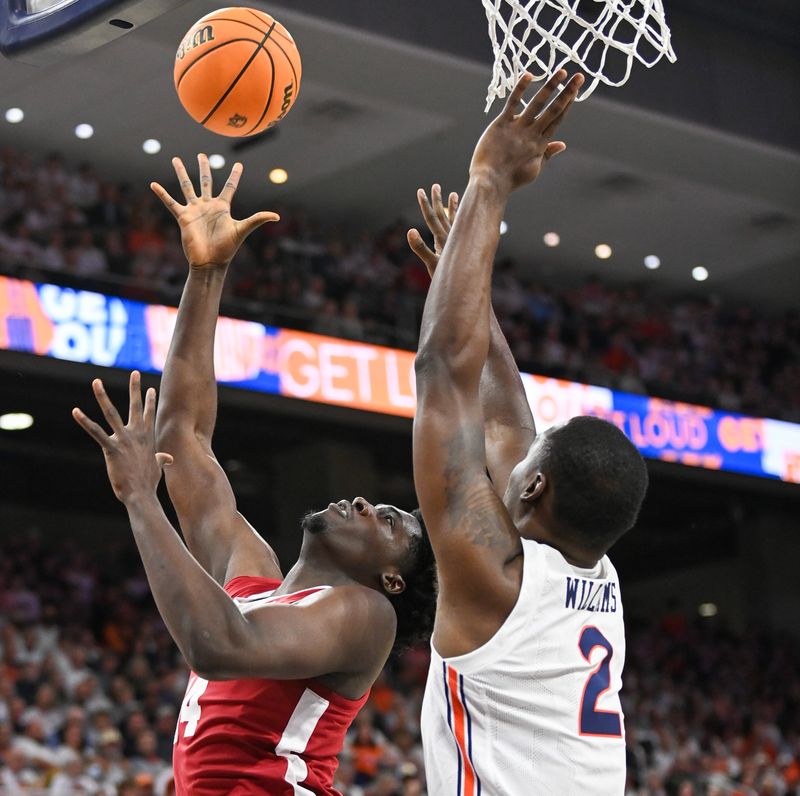 Feb 11, 2023; Auburn, Alabama, USA;  Alabama Crimson Tide center Charles Bediako (14) shoots over Auburn Tigers forward Jaylin Williams (2) at Neville Arena. Mandatory Credit: Julie Bennett-USA TODAY Sports

