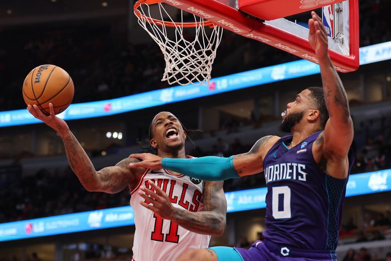 CHICAGO, ILLINOIS - DECEMBER 06: DeMar DeRozan #11 of the Chicago Bulls is fouled by Miles Bridges #0 of the Charlotte Hornets during the first half at the United Center on December 06, 2023 in Chicago, Illinois. NOTE TO USER: User expressly acknowledges and agrees that, by downloading and or using this photograph, User is consenting to the terms and conditions of the Getty Images License Agreement.  (Photo by Michael Reaves/Getty Images)