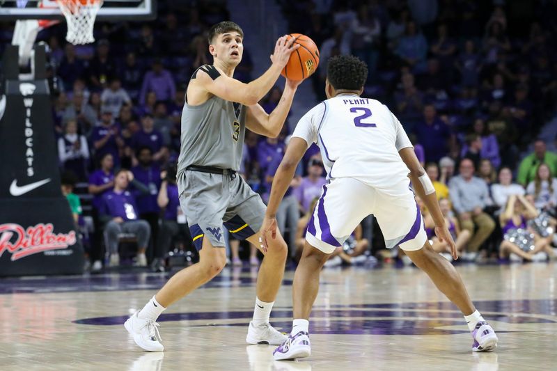 iFeb 26, 2024; Manhattan, Kansas, USA; West Virginia Mountaineers guard Kerr Kriisa (3) is looks for a pass while  Kansas State Wildcats guard Tylor Perry (2) defends during overtime at Bramlage Coliseum. Mandatory Credit: Scott Sewell-USA TODAY Sports