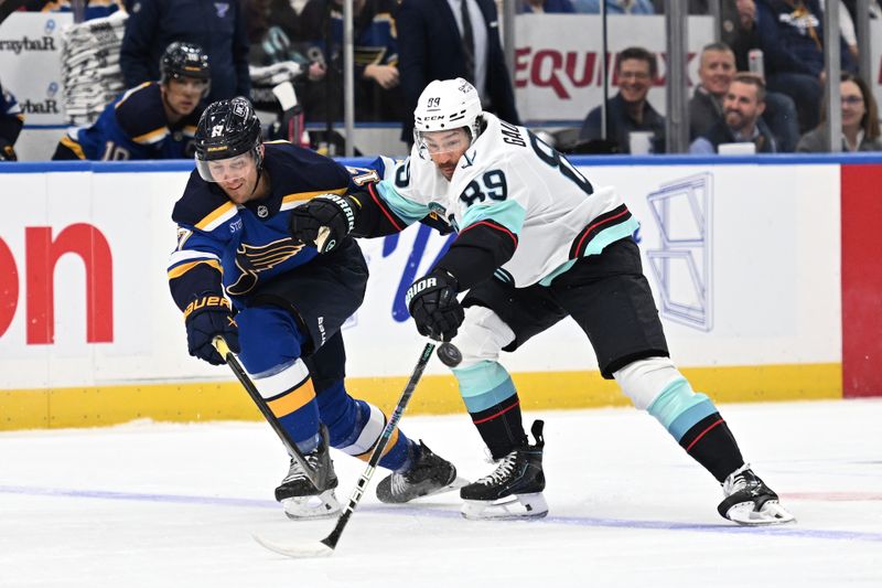 Feb 26, 2026; St. Louis, Missouri, USA; St. Louis Blues defenseman Cam Fowler (17) and Seattle Kraken center Frederick Gaudreau (89) battle for the puck during the first period at Enterprise Center. Mandatory Credit: Joe Puetz-Imagn Images