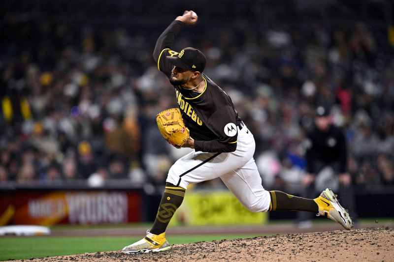 Mar 25, 2024; San Diego, California, USA; San Diego Padres relief pitcher Robert Suarez (75) throws a pitch against the Seattle Mariners during the ninth inning at Petco Park. Mandatory Credit: Orlando Ramirez-USA TODAY Sports