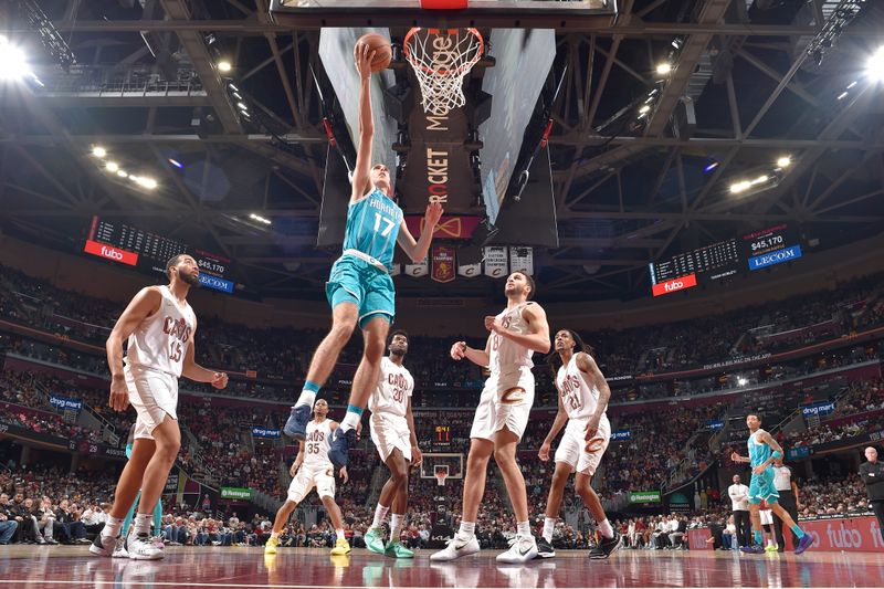 CLEVELAND, OH - APRIL 14: Aleksej Pokusevski #17 of the Charlotte Hornets drives to the basket during the game against the Cleveland Cavaliers on April 14, 2024 at Rocket Mortgage FieldHouse in Cleveland, Ohio. NOTE TO USER: User expressly acknowledges and agrees that, by downloading and/or using this Photograph, user is consenting to the terms and conditions of the Getty Images License Agreement. Mandatory Copyright Notice: Copyright 2024 NBAE (Photo by David Liam Kyle/NBAE via Getty Images)